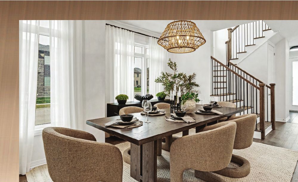 Model home dining room with open staircase