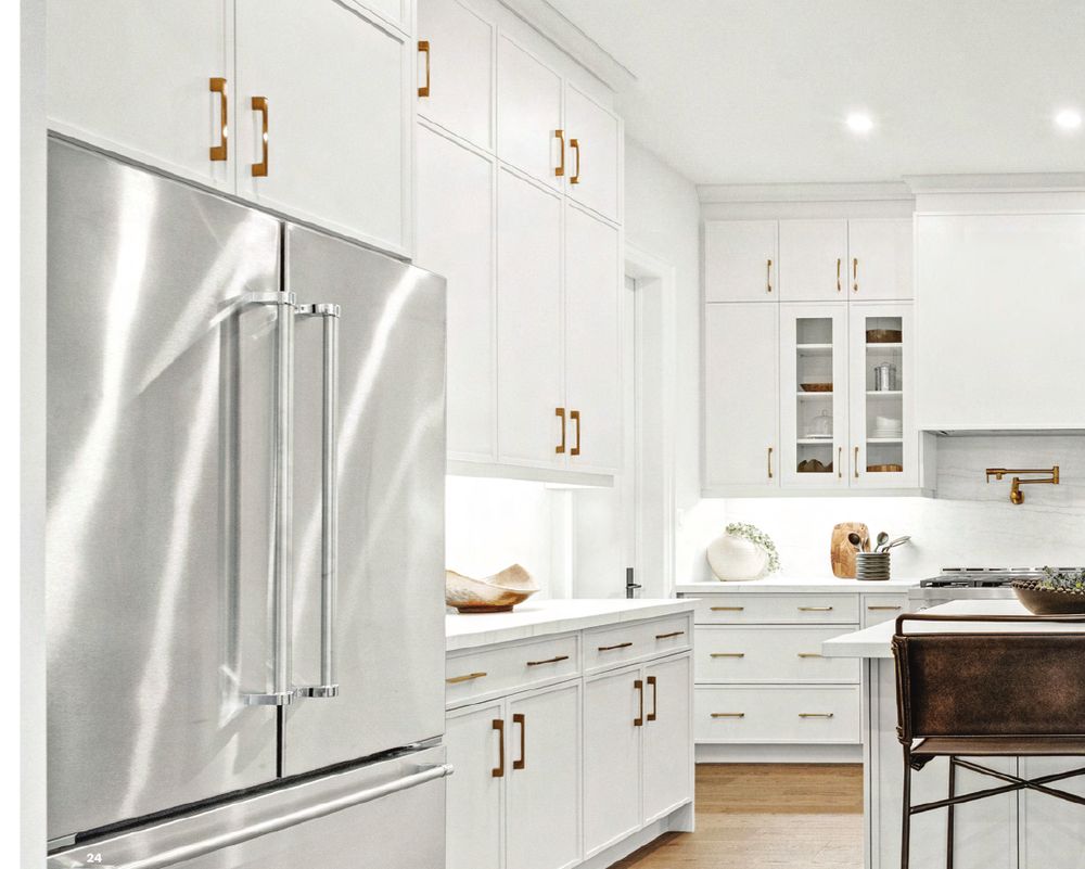 White kitchen with stainless steel fridge